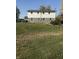 Spacious backyard with a hot tub and patio area at 7571 S County Road 825 E, Plainfield, IN 46168
