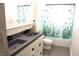 Updated bathroom with double vanity and decorative shower curtain at 7571 S County Road 825 E, Plainfield, IN 46168