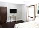 Bedroom with dark hardwood floors and TV at 7571 S County Road 825 E, Plainfield, IN 46168