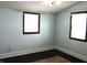Light blue bedroom with dark hardwood floors at 7571 S County Road 825 E, Plainfield, IN 46168