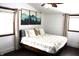 Cozy bedroom with wood floors and mountain art at 7571 S County Road 825 E, Plainfield, IN 46168