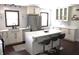 Modern kitchen with white cabinets, quartz countertops, and an island at 7571 S County Road 825 E, Plainfield, IN 46168