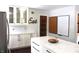 Renovated kitchen with white cabinets, quartz countertops, and a pantry at 7571 S County Road 825 E, Plainfield, IN 46168