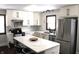 Updated kitchen featuring white cabinets, stainless steel appliances, and an island at 7571 S County Road 825 E, Plainfield, IN 46168