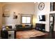 Bright living room featuring hardwood floors, two sofas, and a large TV at 7571 S County Road 825 E, Plainfield, IN 46168
