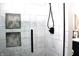 Clean shower with marble-style tile and black fixtures at 7571 S County Road 825 E, Plainfield, IN 46168