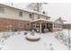 Cozy winter patio with fire pit and covered seating area at 7655 W Village Way, New Palestine, IN 46163