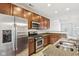 Modern kitchen with stainless steel appliances and granite countertops at 1056 Reserve Way, Indianapolis, IN 46220