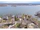 Aerial view showcasing the home's waterfront location and proximity to the lake at 10901 Brigantine Dr, Indianapolis, IN 46256
