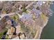 Lakefront homes feature well-manicured lawns and private docks, offering an idyllic waterfront lifestyle at 10901 Brigantine Dr, Indianapolis, IN 46256