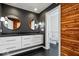 Contemporary bathroom with double vanity and wood accents at 10901 Brigantine Dr, Indianapolis, IN 46256