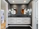 Modern bathroom with double vanity and dark accents at 10901 Brigantine Dr, Indianapolis, IN 46256