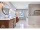 Large bathroom with double vanity and marble floors at 10901 Brigantine Dr, Indianapolis, IN 46256