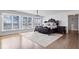 Elegant main bedroom with a luxurious bed and hardwood floors at 10901 Brigantine Dr, Indianapolis, IN 46256