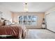 Bright bedroom with lake view and cozy bedding at 10901 Brigantine Dr, Indianapolis, IN 46256