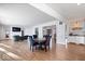 Bright dining area with hardwood floors and open kitchen views at 10901 Brigantine Dr, Indianapolis, IN 46256