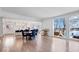 Open concept dining room with hardwood floors and adjacent kitchen at 10901 Brigantine Dr, Indianapolis, IN 46256
