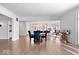 Open concept dining room with hardwood floors and kitchen access at 10901 Brigantine Dr, Indianapolis, IN 46256