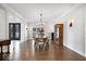 Spacious dining room with hardwood floors, chandelier, and classic wooden furnishings at 10901 Brigantine Dr, Indianapolis, IN 46256