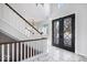 Bright entryway with marble floors and double doors at 10901 Brigantine Dr, Indianapolis, IN 46256