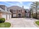 Attractive brick home with a circular driveway and basketball hoop at 10901 Brigantine Dr, Indianapolis, IN 46256