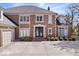 Elegant brick home with symmetrical design, grand entrance, and meticulously maintained landscaping at 10901 Brigantine Dr, Indianapolis, IN 46256