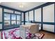 Serene home office with built-in shelves, a lake view, and a navy blue accent wall at 10901 Brigantine Dr, Indianapolis, IN 46256