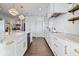 White kitchen with marble countertops and gold accents at 10901 Brigantine Dr, Indianapolis, IN 46256