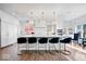 Modern kitchen island with white cabinets and quartz countertops at 10901 Brigantine Dr, Indianapolis, IN 46256
