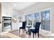 Modern kitchen featuring stainless steel appliances and a charming breakfast nook with lake views at 10901 Brigantine Dr, Indianapolis, IN 46256