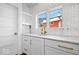 White kitchen with quartz countertops and gold hardware at 10901 Brigantine Dr, Indianapolis, IN 46256