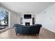 Living room with hardwood floors, fireplace, and lake view at 10901 Brigantine Dr, Indianapolis, IN 46256
