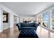 Bright living room with hardwood floors, open concept to kitchen, and water views at 10901 Brigantine Dr, Indianapolis, IN 46256