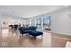 Living room with hardwood floors, lake views, and comfy seating at 10901 Brigantine Dr, Indianapolis, IN 46256