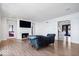 Spacious living room features hardwood floors, fireplace, and large windows at 10901 Brigantine Dr, Indianapolis, IN 46256