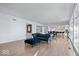 Sunlit living room showcasing hardwood floors and an open floor plan at 10901 Brigantine Dr, Indianapolis, IN 46256