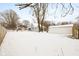 View of backyard with detached garage in winter at 1430 St Paul St, Indianapolis, IN 46203