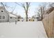 Snow-covered backyard, detached garage and fence at 1430 St Paul St, Indianapolis, IN 46203