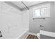 Clean bathroom with a shower/tub combo and window at 1430 St Paul St, Indianapolis, IN 46203
