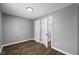 Spacious bedroom with wood-look floors and neutral walls at 1430 St Paul St, Indianapolis, IN 46203