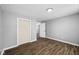 Simple bedroom with wood-look floors and neutral walls at 1430 St Paul St, Indianapolis, IN 46203