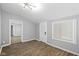 Gray walls, wood floors, white door and view into living room at 1430 St Paul St, Indianapolis, IN 46203