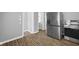 Kitchen with stainless steel appliances and wood-look floors at 1430 St Paul St, Indianapolis, IN 46203