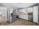 Modern kitchen with stainless steel appliances and white cabinets at 1430 St Paul St, Indianapolis, IN 46203