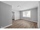 Gray walls, wood floors, and access to other rooms at 1430 St Paul St, Indianapolis, IN 46203