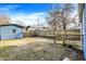 Backyard with wooden fence, shed, and small deck at 1745 S Talbott St, Indianapolis, IN 46225
