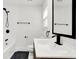 Modern bathroom with white subway tile and black fixtures at 1745 S Talbott St, Indianapolis, IN 46225
