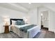 Cozy bedroom with ensuite bathroom and hardwood floors at 1745 S Talbott St, Indianapolis, IN 46225