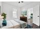 Bright bedroom with hardwood floors and ceiling fan at 1745 S Talbott St, Indianapolis, IN 46225