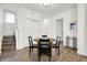 Bright dining area with round table and four chairs, hardwood floors, and access to living room at 1745 S Talbott St, Indianapolis, IN 46225